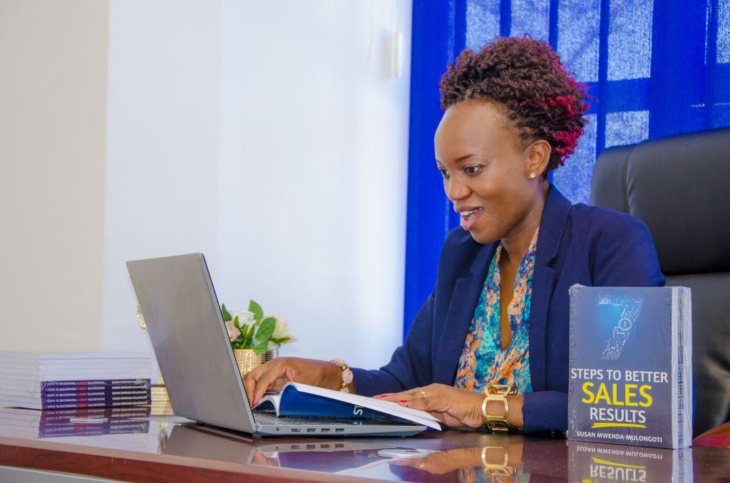 Business professional planning work with a laptop and notebook