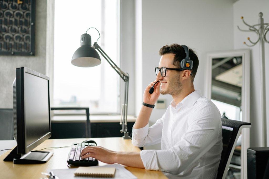 Man at his computer creating a website