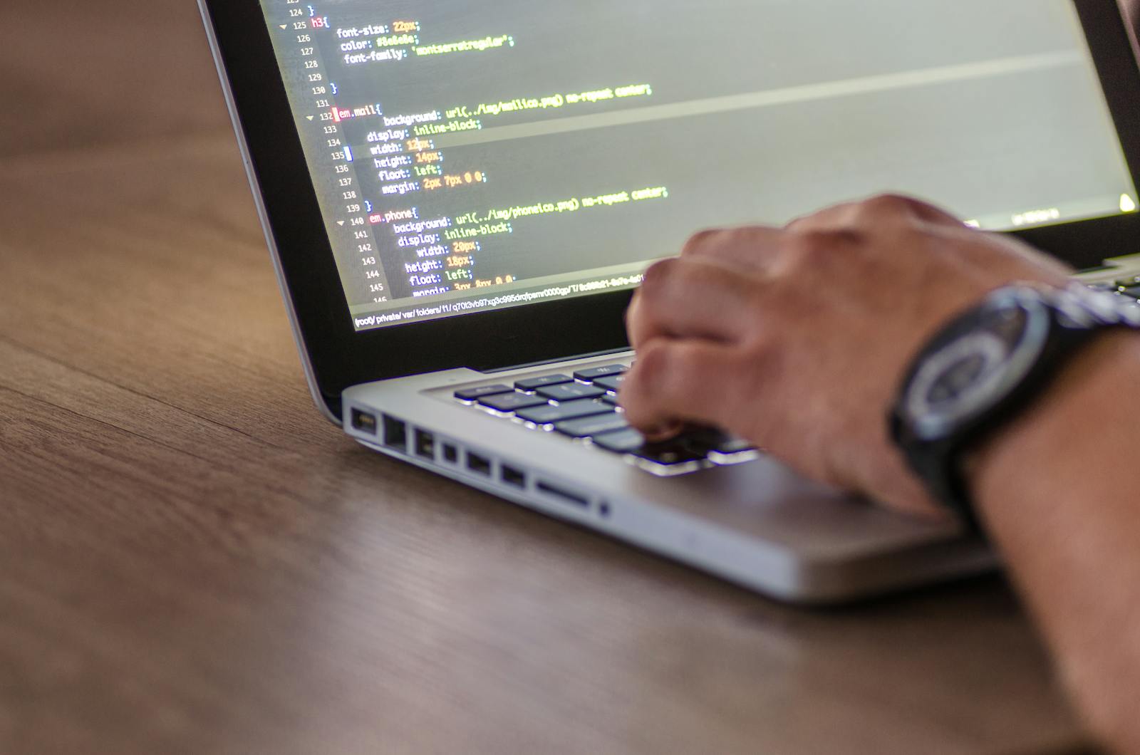 Engineer implementing prioritized website fixes