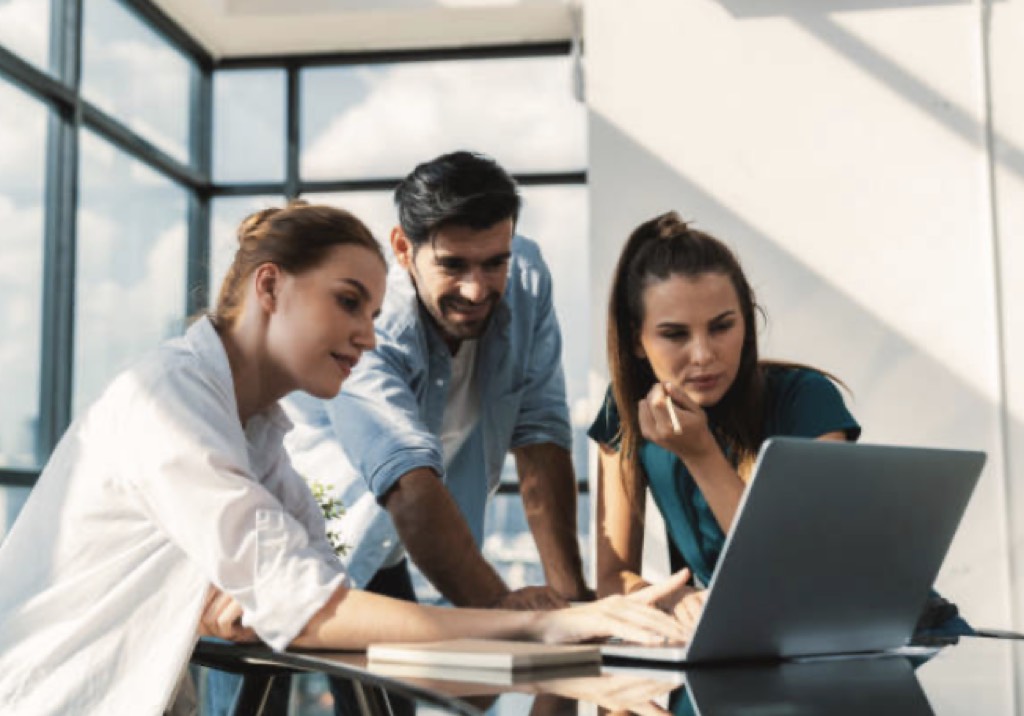 People reviewing a project on a computer